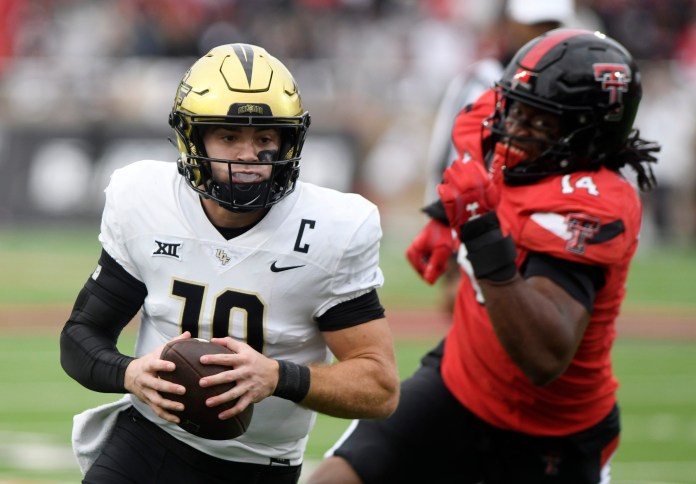 UCF's quarterback John Rhys Plumlee (10) runs with the ball against Texas Tech in a Big 12 football game