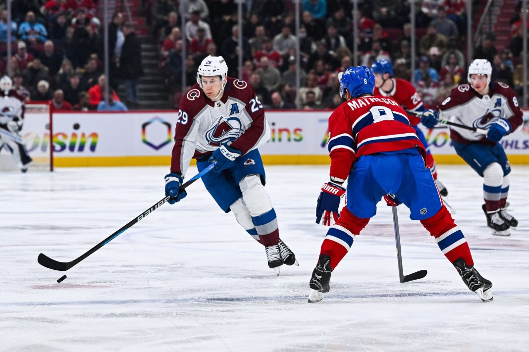 Colorado Avalanche center Nathan MacKinnon (29) plays the puck against Montreal Canadiens defenseman Mike Matheson (8) during the second period at Bell Centre