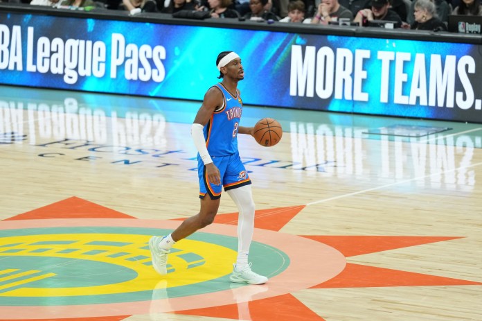 Oklahoma City Thunder guard Shai Gilgeous-Alexander brings the ball up the court against the San Antonio Spurs.