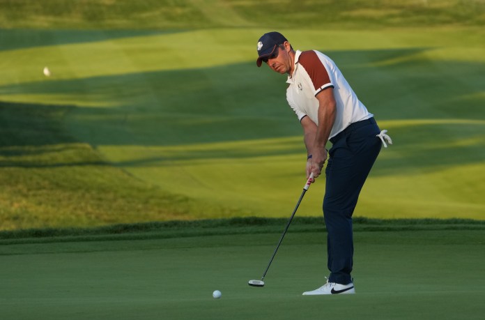 Team Europe golfer Rory McIlroy putts on the 16th green during day two fourballs round for the 44th Ryder Cup golf competition at Marco Simone Golf and Country Club