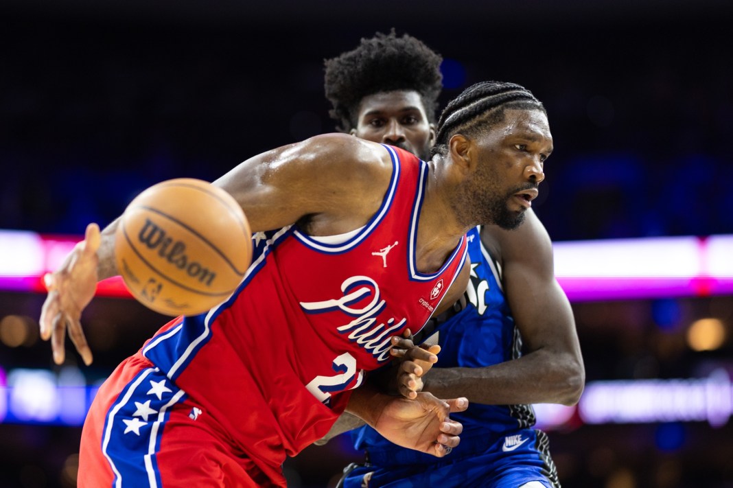 Philadelphia 76ers center Joel Embiid drives against Orlando Magic forward Jonathan Isaac during the third quarter at Wells Fargo Center.