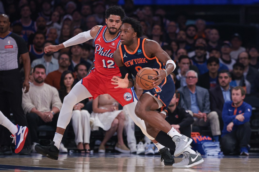 New York Knicks forward OG Anunoby dribbles against Philadelphia 76ers forward Tobias Harris during game two of the 2024 NBA playoffs.