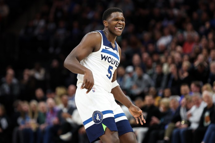 Minnesota Timberwolves guard Anthony Edwards (5) reacts to his shot against the Toronto Raptors