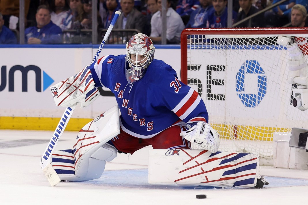 New York Rangers goaltender Igor Shesterkin passes the puck in the second period against the New York Islanders at Madison Square Garden.