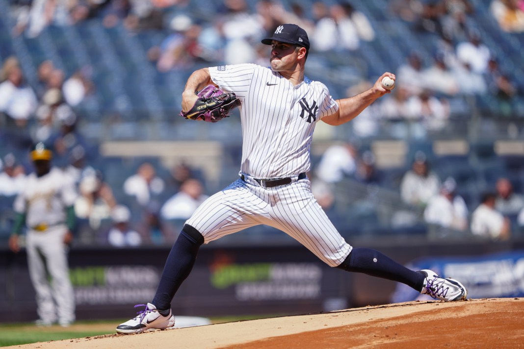 New York Yankees pitcher Carlos Rodon delivers against the Oakland Athletics during the first inning at Yankee Stadium.