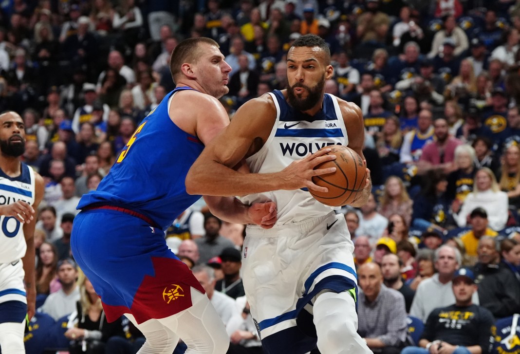 Minnesota Timberwolves center Rudy Gobert (27) and Denver Nuggets center Nikola Jokic (15) in the first quarter during game one of the second round for the 2024 NBA playoffs at Ball Arena