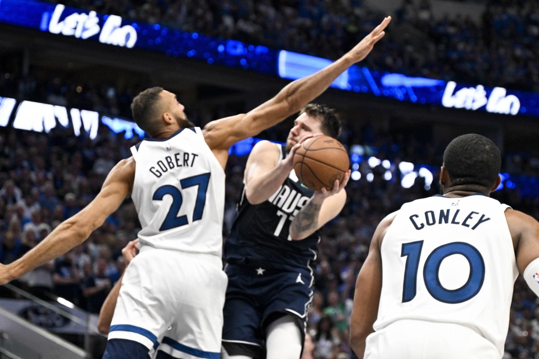 Minnesota Timberwolves center Rudy Gobert contests a shot from Dallas Mavericks star Luka Doncic in Game 3 of the Western Conference Finals.