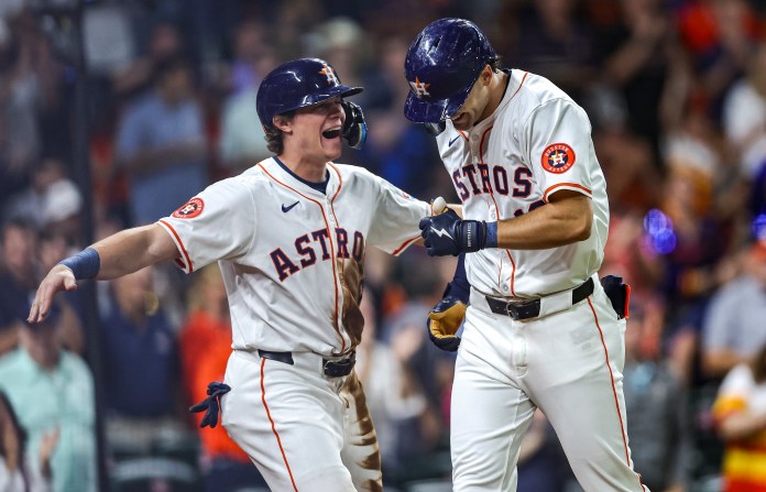 Houston Astros left fielder Joey Loperfido celebrates with center fielder Jake Meyers after hitting a home run during the third inning against the Oakland Athletics.