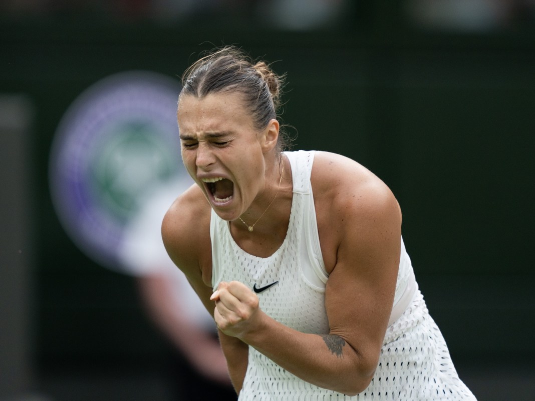 Aryna Sabalenka celebrates a big point in her match against Ons Jabeur at Wimbledon in 2023.