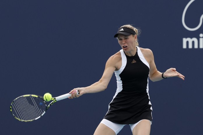 Caroline Wozniacki hits a forehand in her match against Anhelina Kalinina at the Miami Open.