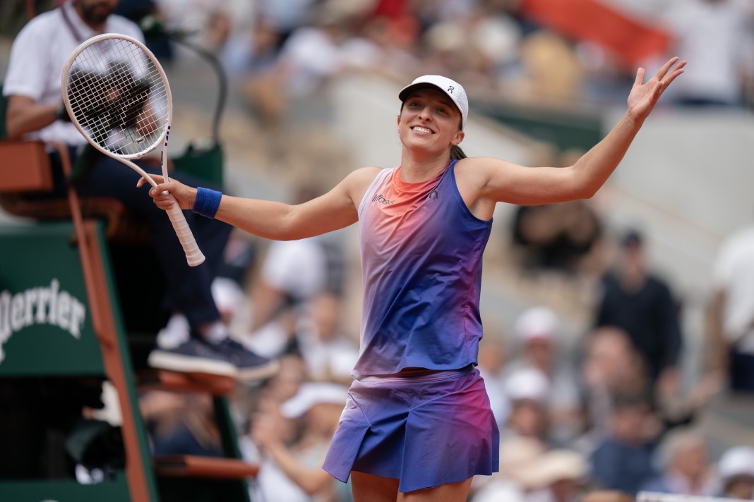 Iga Swiatek celebrates a win over Marketa Vondrousova in the French Open quarterfinals.