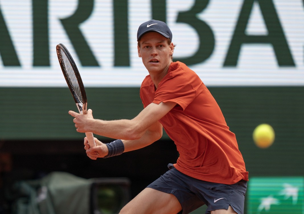 Jannik Sinner prepares to hit a forehand in his match against Grigor Dimitrov at the 2024 French Open.