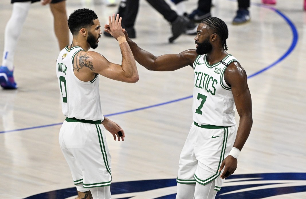 Boston Celtics stars Jayson Tatum and Jaylen Brown celebrate a big play against the Dallas Mavericks in the NBA Finals.