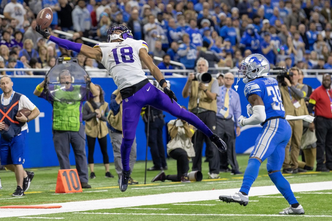 Minnesota Vikings wide receiver Justin Jefferson (18) is unable to make a catch in front of Detroit Lions cornerback Jerry Jacobs (39)