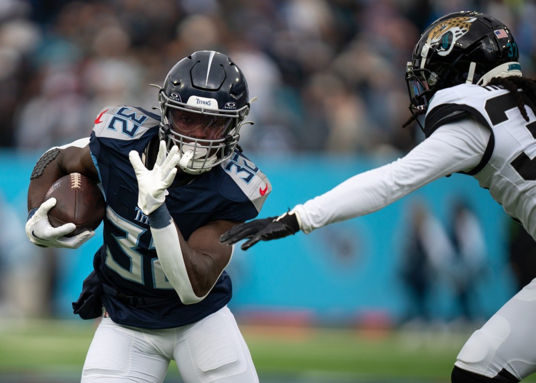 Tennessee Titans running back Tyjae Spears runs for a touchdown after breaking several Jacksonville Jaguars tackles in their game.