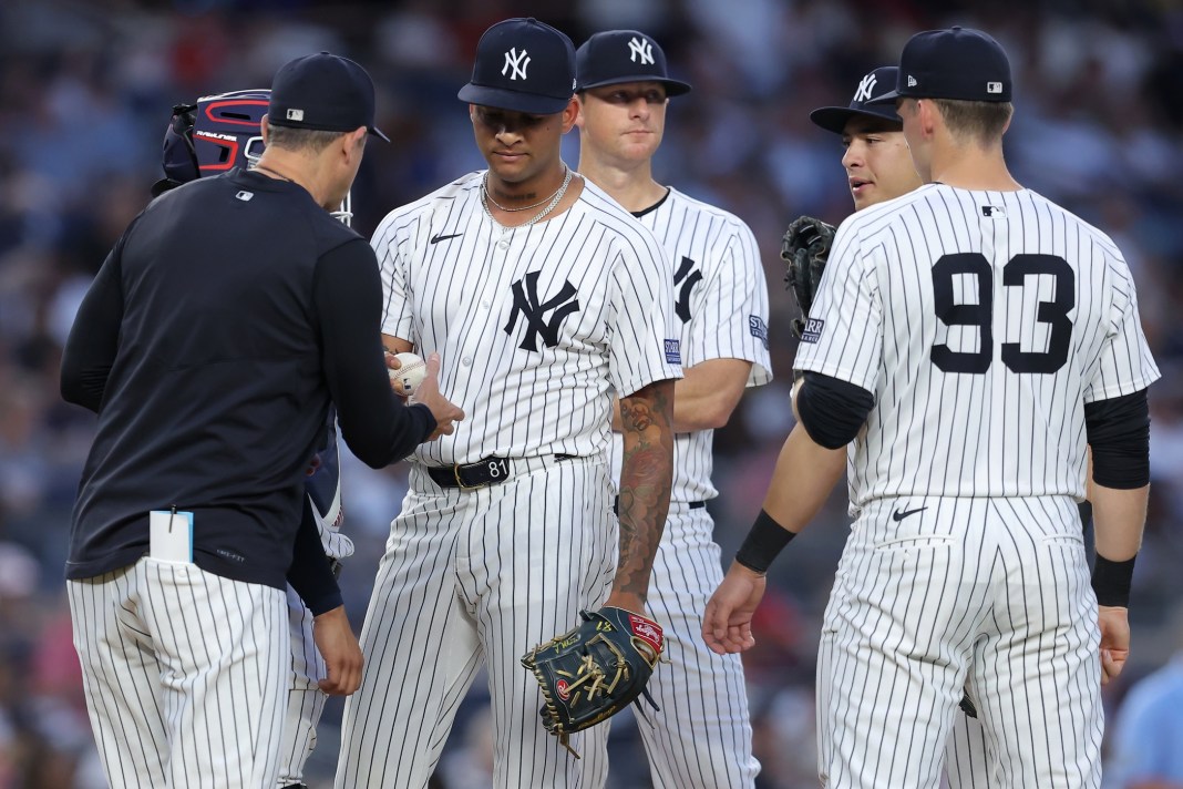 luis gil taken out of the game by aaron boone