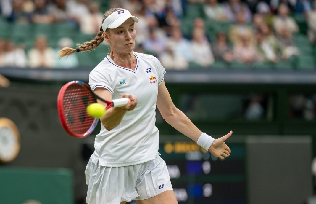 Elena Rybakina hits a shot against Anna Kalinskaya at Wimbledon.