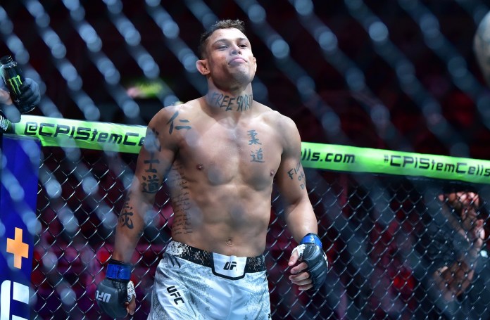 Paul Craig (red gloves) fights Caio Borralho (blue gloves) during UFC 301 at Rio Arena in Rio de Janeiro, Brazil, on May 4, 2024.