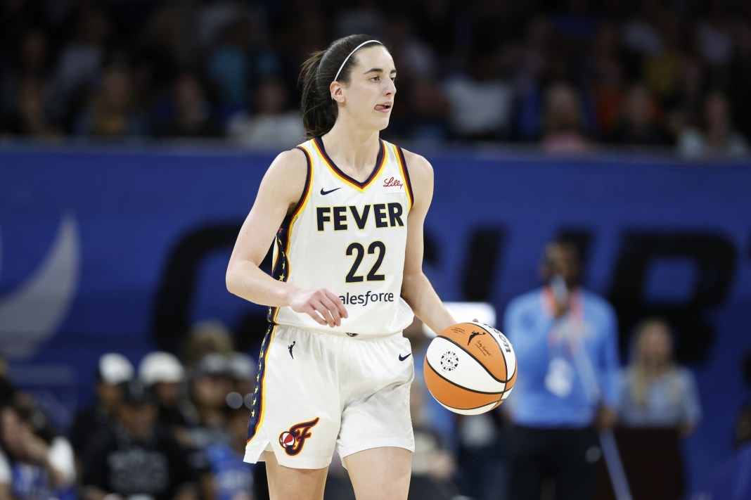 Indiana Fever guard Caitlin Clark (22) brings the ball up the court against the Chicago Sky during the first half of a basketball game at Wintrust Arena in Chicago, Illinois, on June 23, 2024.