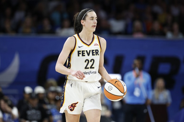 Indiana Fever guard Caitlin Clark (22) brings the ball up the court against the Chicago Sky during the first half of a basketball game at Wintrust Arena in Chicago, Illinois, on June 23, 2024.