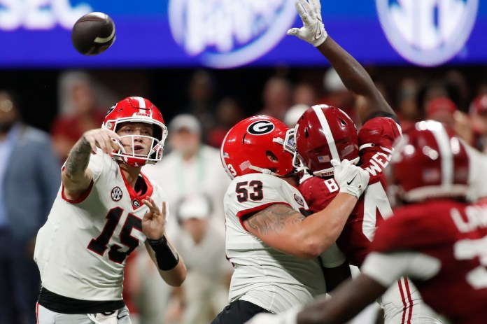 Georgia quarterback Carson Beck (15) throws a pass during the second half of the SEC Championship game against Alabama at Mercedes-Benz Stadium in Atlanta on December 2, 2023. Alabama won 27-24.