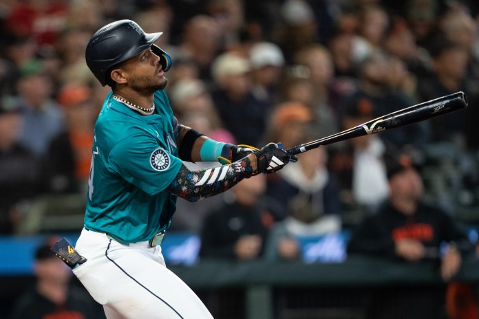 Seattle Mariners centerfielder Julio Rodriguez (44) hits a double during the seventh inning of the game against the San Francisco Giants at T-Mobile Park in Seattle, Washington, on August 23, 2024.