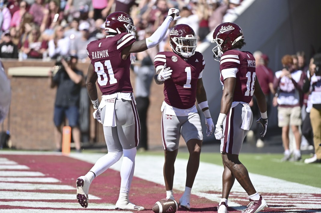 Mississippi State Bulldogs wide receiver Zavion Thomas (1) celebrates with tight end Antonio Harmon (81) and wide receiver Jordan Mosley (18) after a touchdown against the Western Michigan Broncos during the first quarter at Davis Wade Stadium at Scott Field.