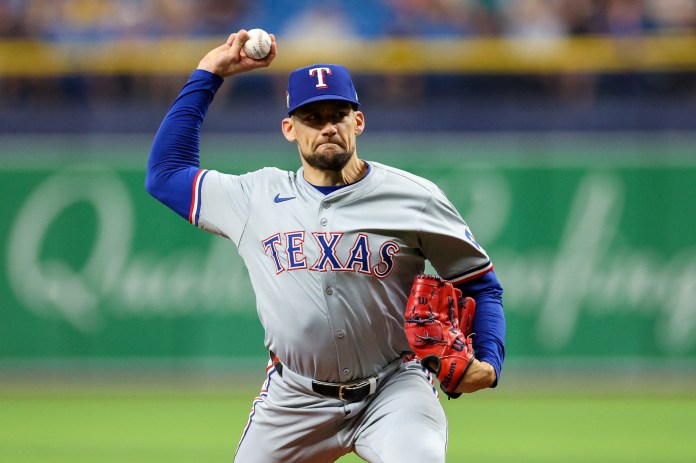 Texas Rangers starting pitcher Nathan Eovaldi (17) delivers a pitch during the first inning of the game against the Tampa Bay Rays at Tropicana Field in St. Petersburg, Florida, on April 3, 2024.