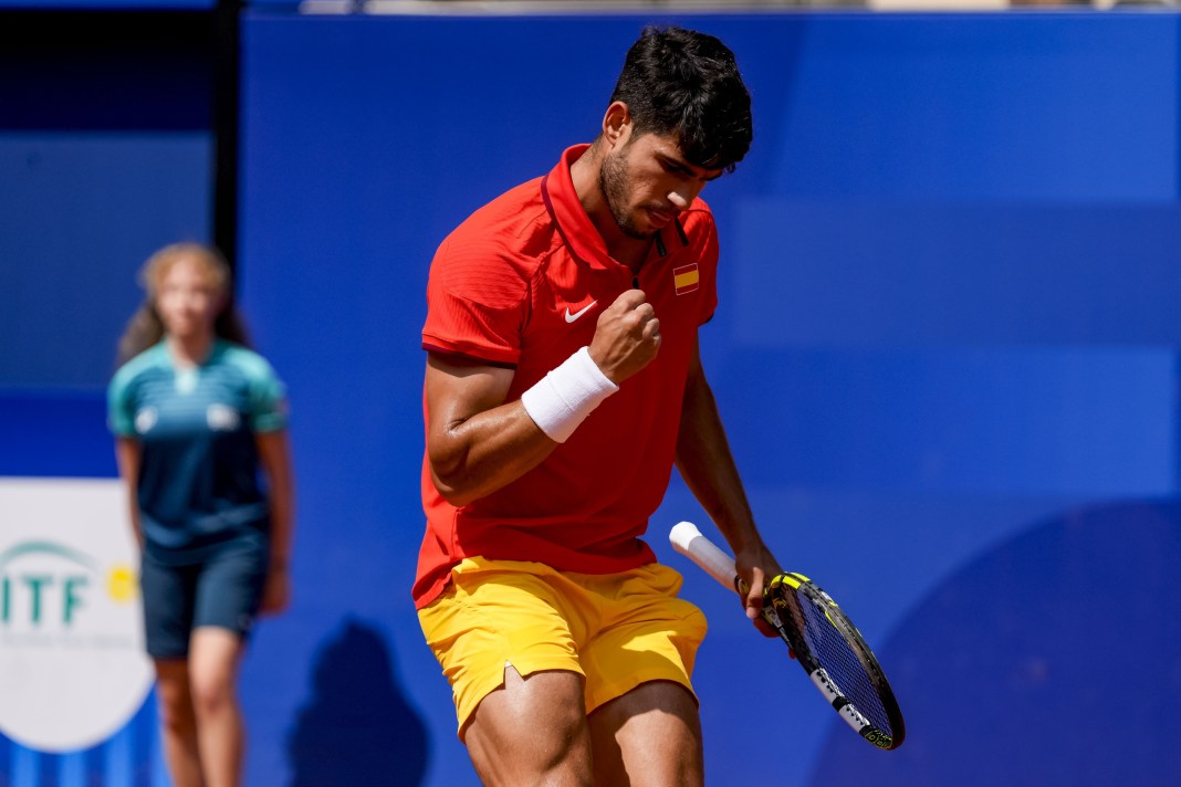 Carlos Alcaraz celebrates a big point against Tommy Paul at the 2024 Paris Olympics.