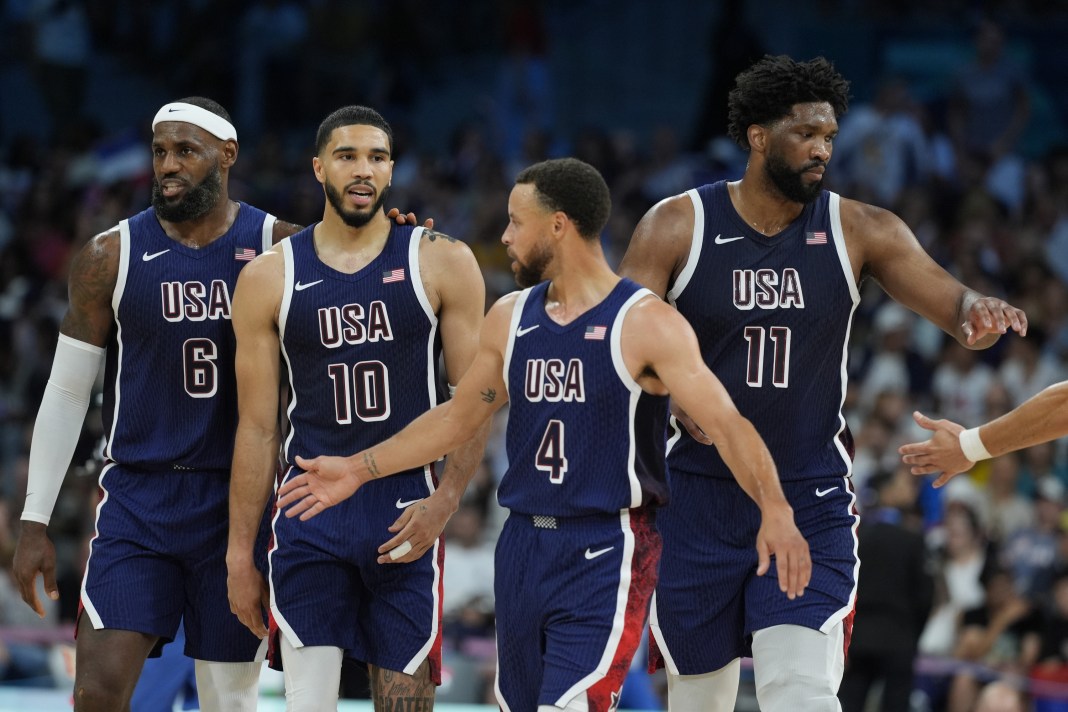 LeBron James, Jayson Tatum, Steph Curry and Joel Embiid walk during Team USA's win over Puerto Rico at the 2024 Paris Olympics.