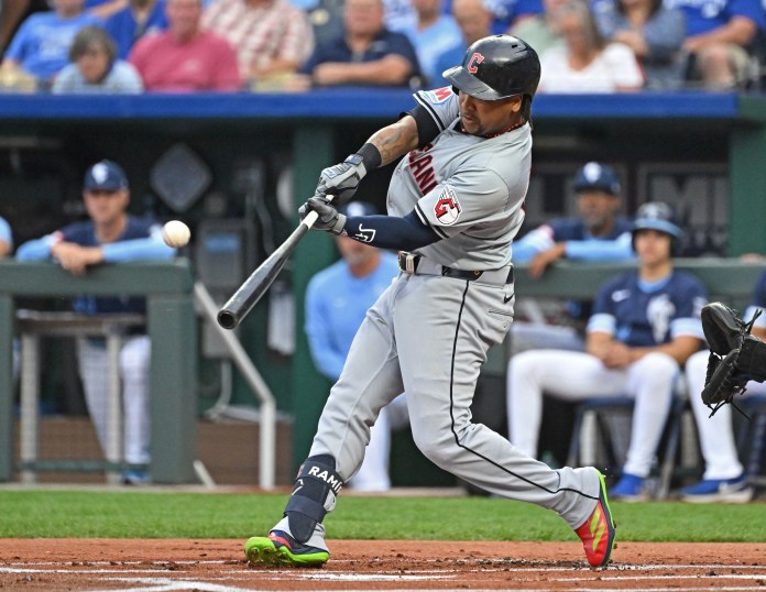 Cleveland Guardians third baseman Jose Ramirez (11) hits a solo home run in the first inning against the Kansas City Royals at Kauffman Stadium on June 28, 2024.