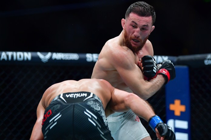 Merab Dvalishvili moves in with a hit against Henry Cejudo during UFC 298 at Honda Center in Anaheim, California, on February 17, 2024.