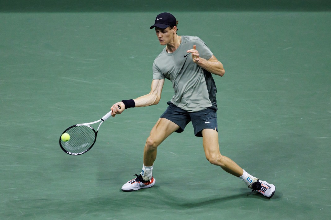 Jannik Sinner hits a forehand in his win over Daniil Medvedev in the 2024 US Open quarterfinals.