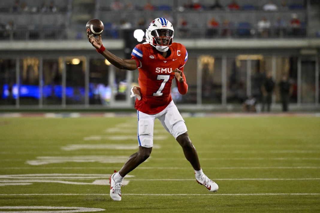 SMU quarterback Kevin Jennings throws a pass against BYU.