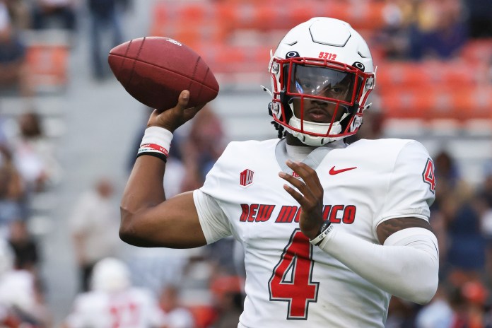 New Mexico Lobos quarterback Devon Dampier (4) warms up before the game against the Auburn Tigers at Jordan-Hare Stadium on September 14, 2024.