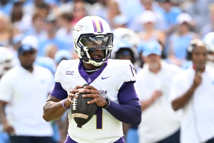 James Madison Dukes quarterback Alonza Barnett III (14) looks to pass during the second quarter at Kenan Memorial Stadium on September 21, 2024.