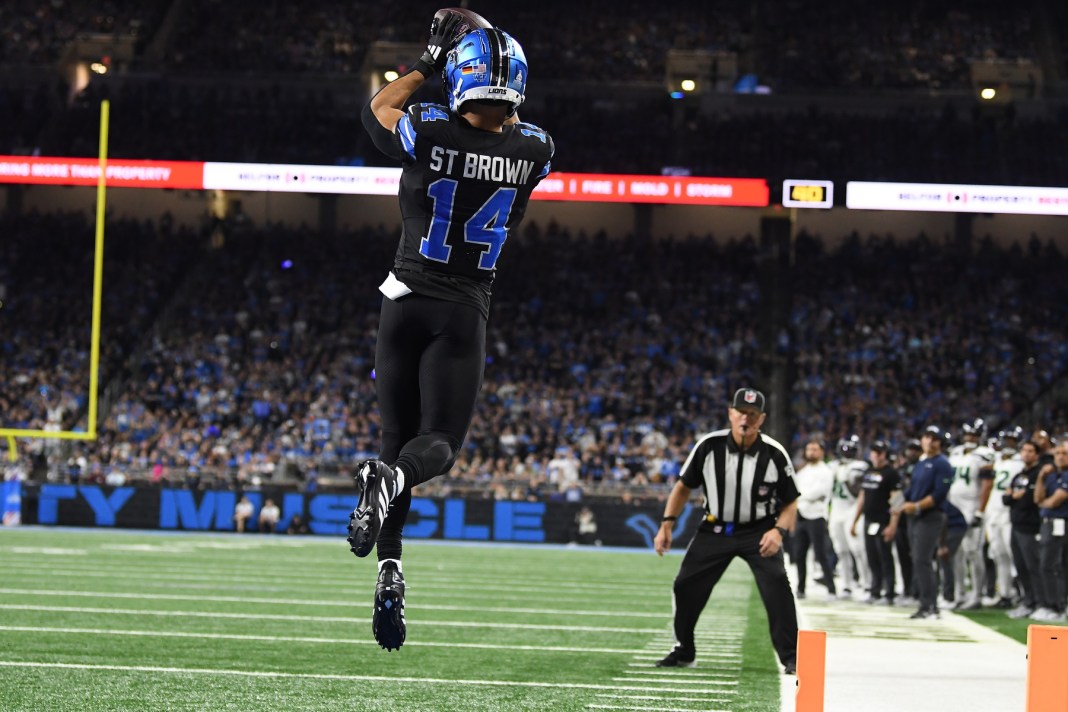 Detroit Lions wide receiver Amon-Ra St. Brown (14) catches a touchdown pass against the Seattle Seahawks in the fourth quarter at Ford Field