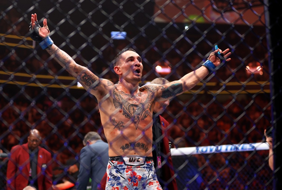 Max Holloway celebrates after knocking out Justin Gaethje (not pictured) during UFC 300