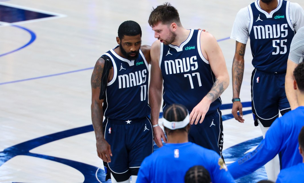 Mavericks stars Luka Doncic and Kyrie Irving talk during the NBA Finals.