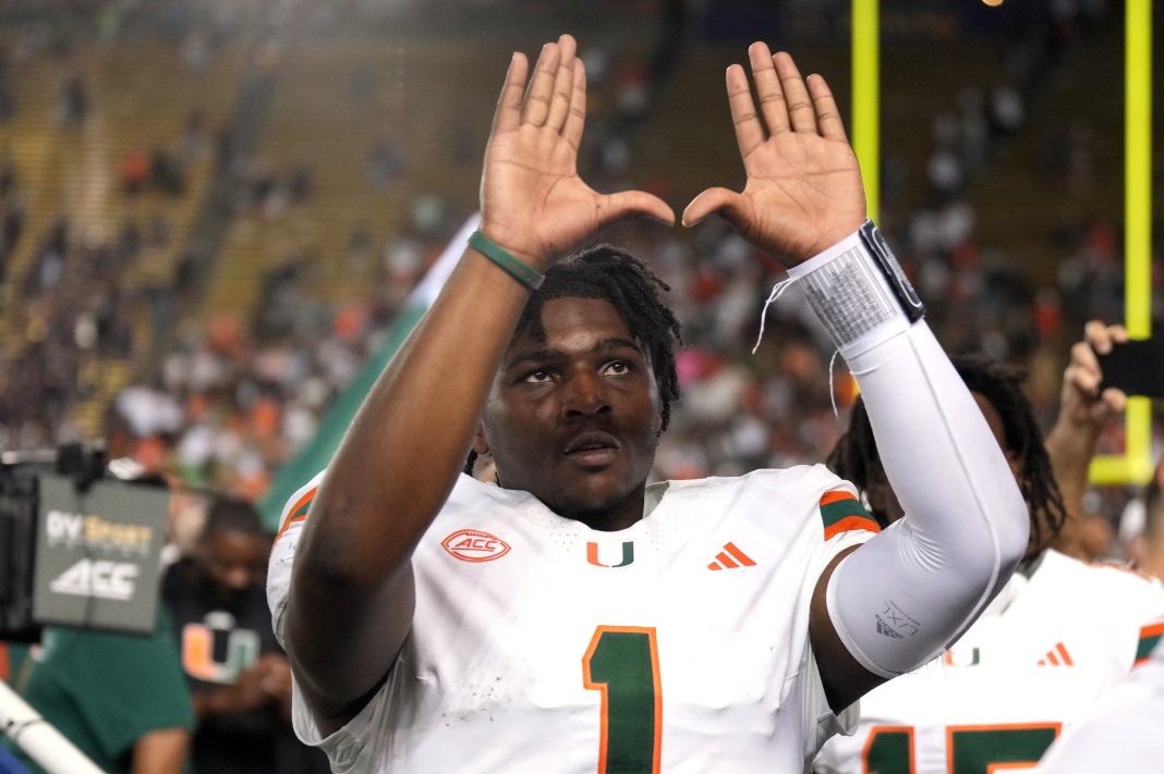 Miami quarterback Cam Ward celebrates an insane comeback win over California.