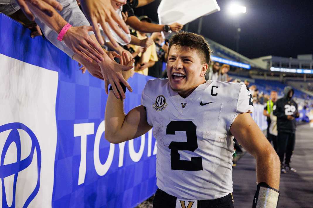 Vanderbilt Commodores quarterback Diego Pavia (2) high fives fans in the stands after a game against the Kentucky Wildcats at Kroger Field