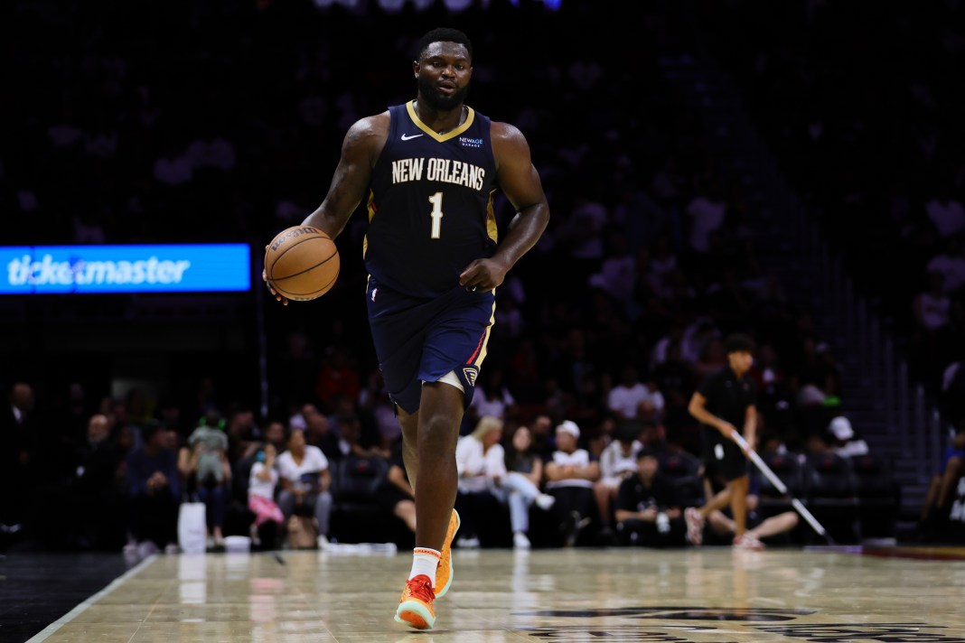 Pelicans star Zion Williamson brings the ball up against the Heat in a preseason game.