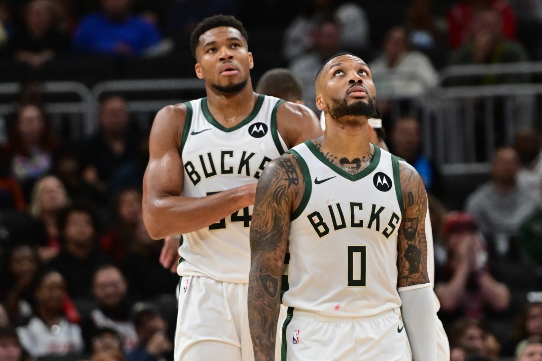 Bucks stars Giannis Antetokounmpo and Damian Lillard look on against the Bulls.