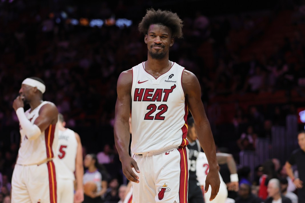 Heat star Jimmy Butler reacts in a game against the Spurs in the preseason.