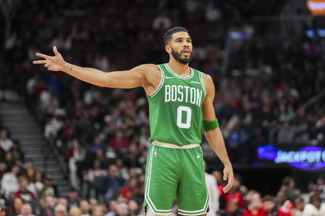 Celtics star Jayson Tatum celebrates a made 3 against the Raptors in a preseason game.