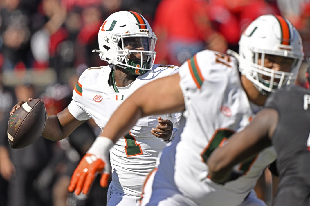 Miami quarterback Cam Ward throws a pass in a win over Louisville in Week 8 of the college football season.