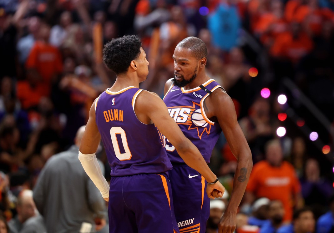 Suns star Kevin Durant celebrates with rookie Ryan Dunn in a meeting with the Mavericks.