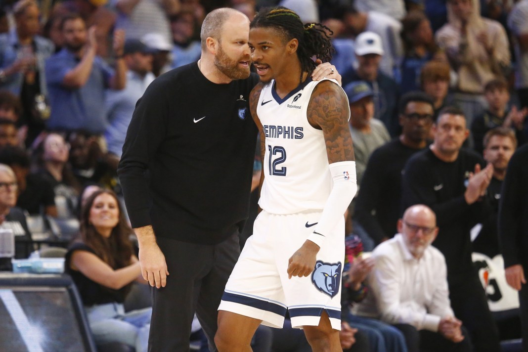 Memphis Grizzlies head coach Taylor Jenkins (left) talks with guard Ja Morant during the second half against the Brooklyn Nets at FedExForum.