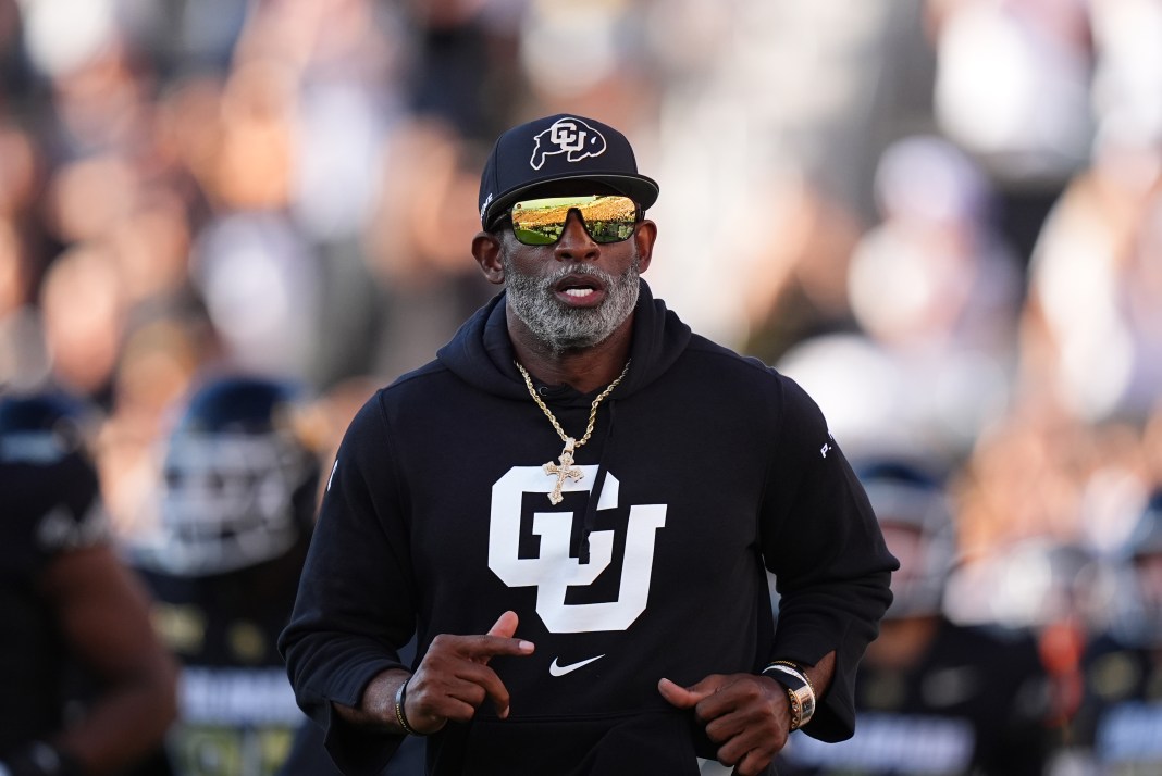 Colorado Buffaloes head coach Deion Sanders runs onto the field before the game against the North Dakota State Bison at Folsom Field on August 29, 2024.