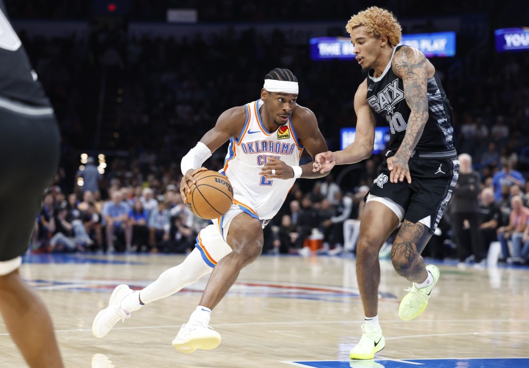 Oklahoma City Thunder guard Shai Gilgeous-Alexander drives to the basket against San Antonio Spurs forward Jeremy Sochan during the second half at Paycom Center.